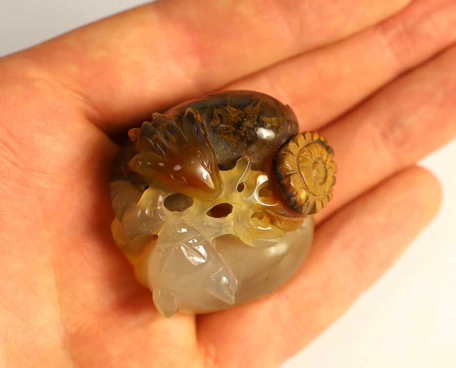 A Chinese two colour agate carving of a ram and a cat, 19th century, 4cm, wood stand